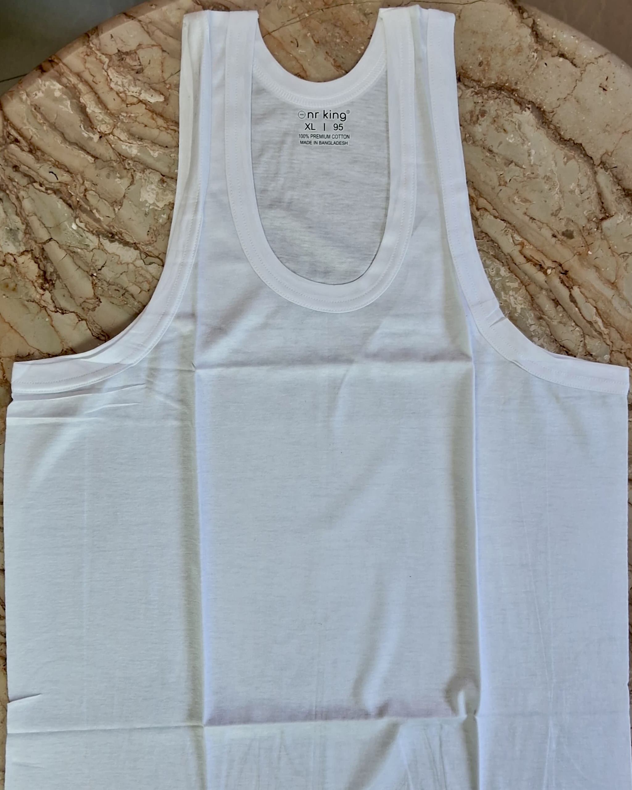 Full laid-out view of NR KING sleeveless innerwear showing cut and size